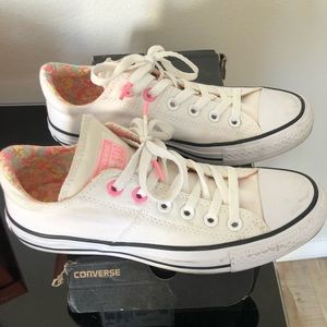 Converse sneakers.  White with pink trim.  Good used condition .